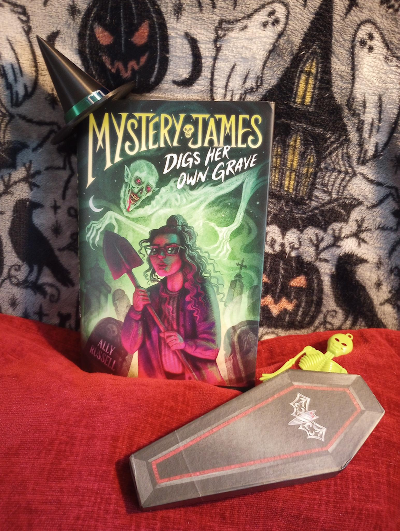 picture of book with spooky accessories